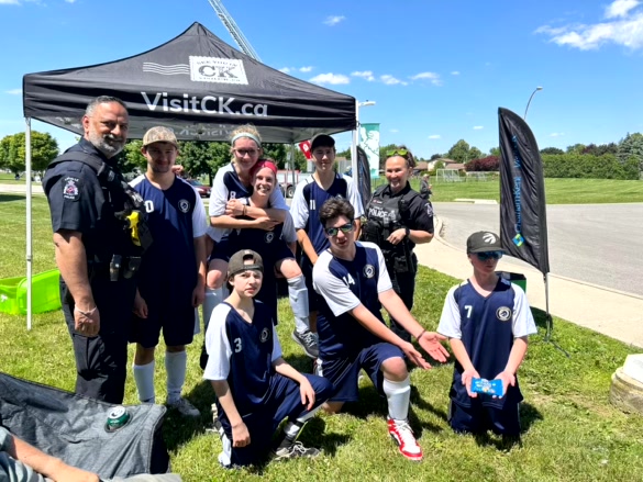 group of people posing outside for a photo