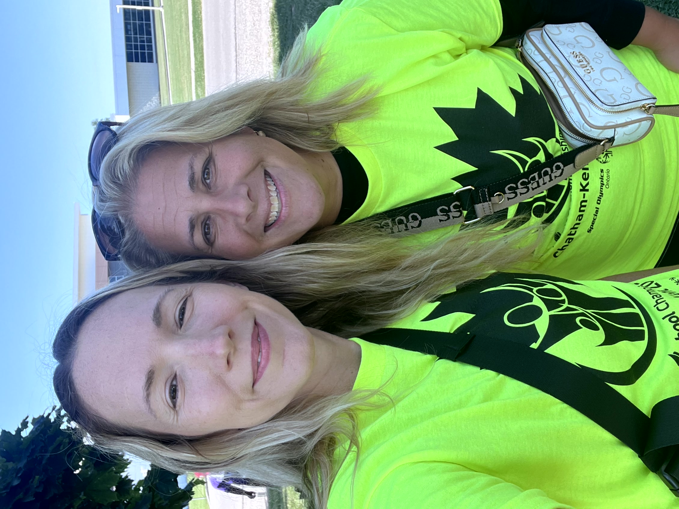 two people in yellow shirts