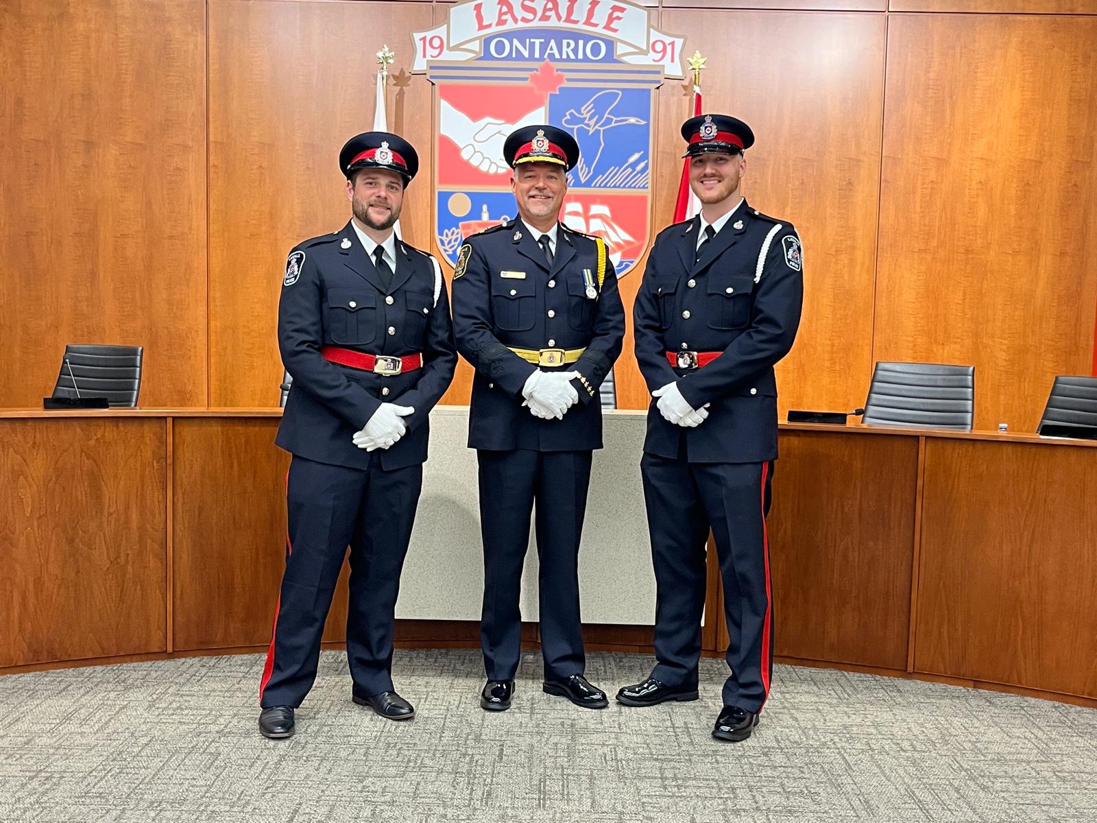 Three police officers in Council Chambers
