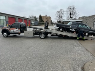 Car loaded onto tow truck