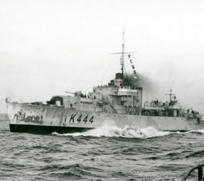 A ship on choppy water in black and white