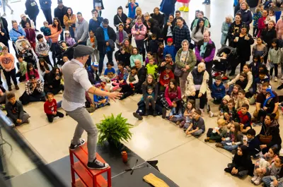 Performer on stage in front of a crowd at LaSalle Spring Fling 2024.