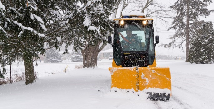 Trackless Machine Clearing Snow