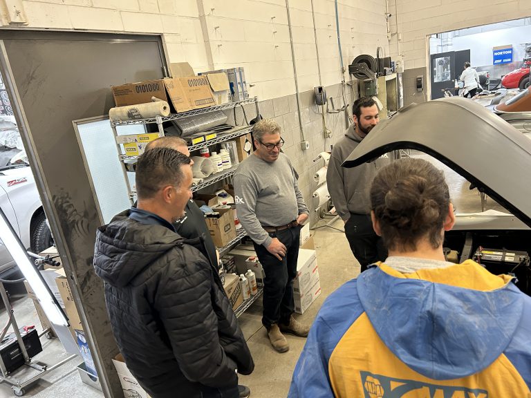 people inspecting car