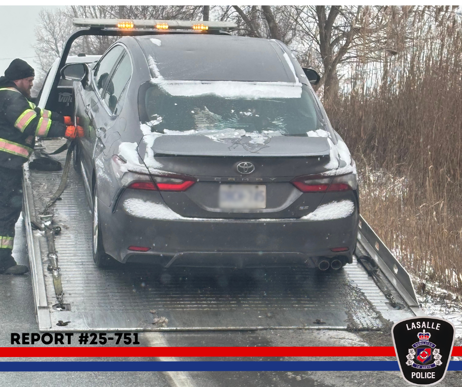 grey sedan being towed