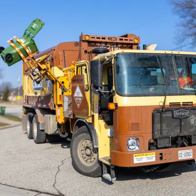 Green Bin truck collecting waste 