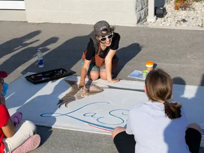 People painting a banner together.