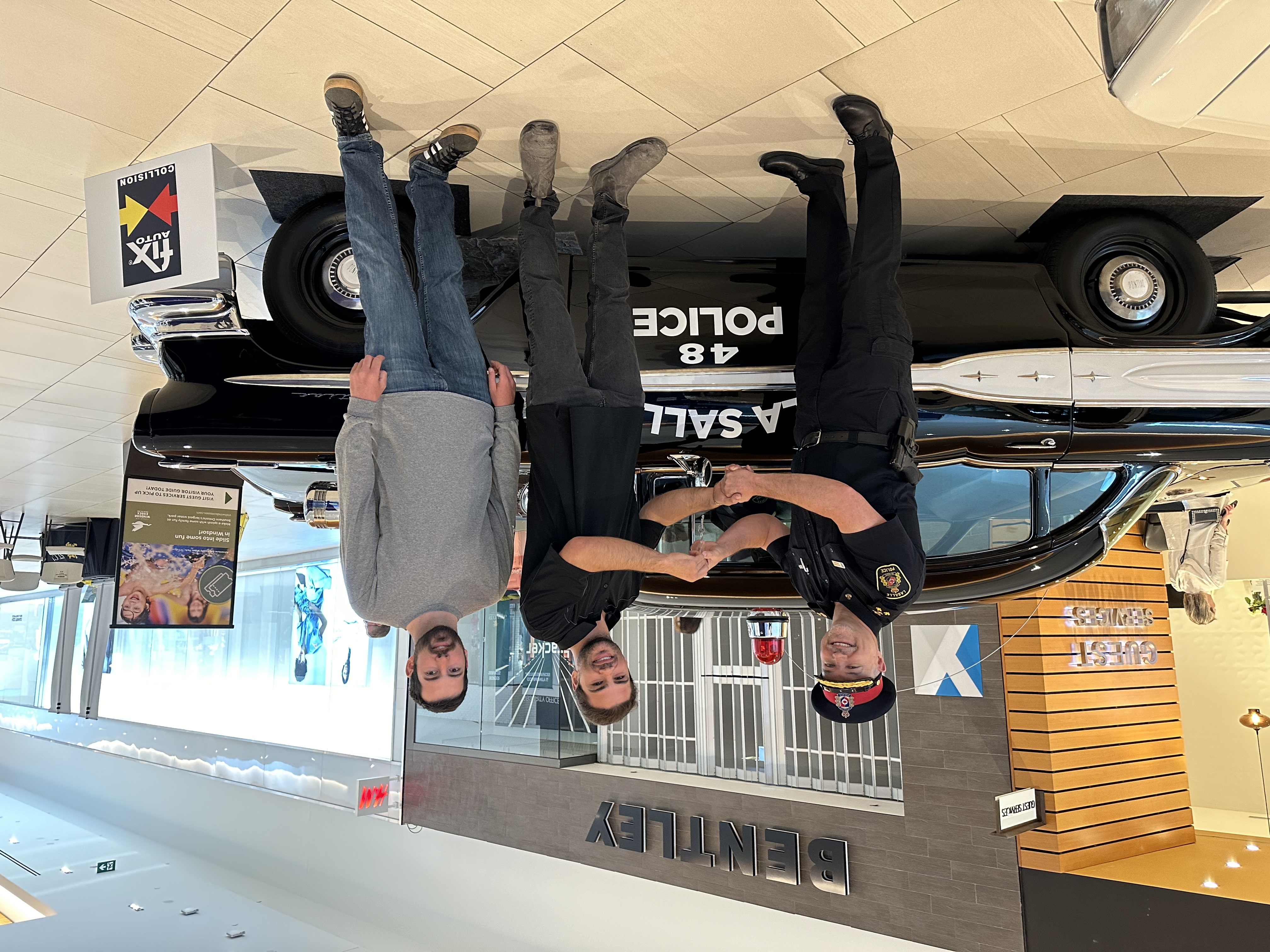 3 men and a police car