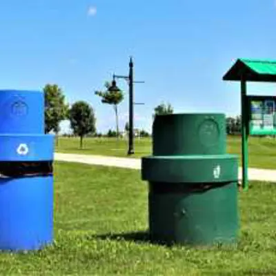 Outdoor green and blue bins.